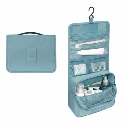 Blue travel toiletry bag with items inside on a white background