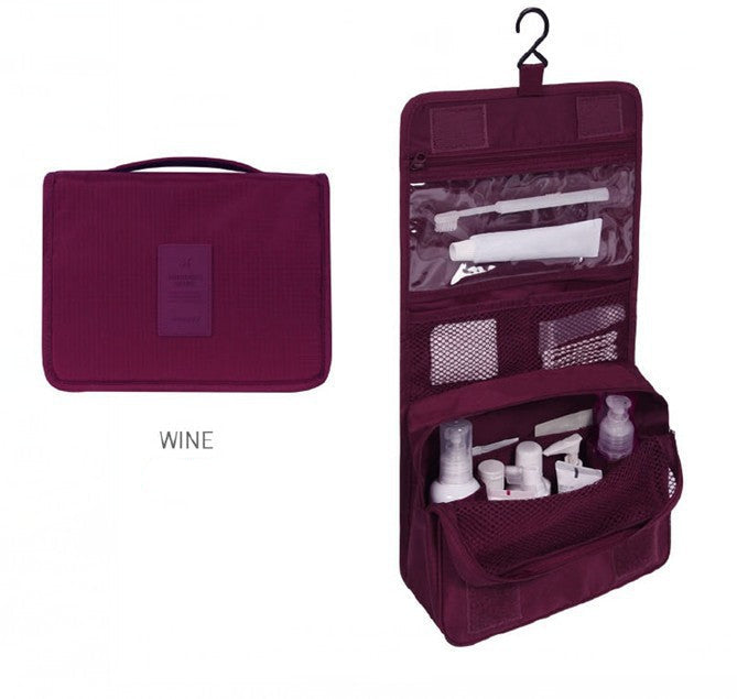 Wine-colored travel toiletry bag with products inside on a white background