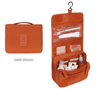 Dark orange travel toiletry bag with compartments on a white background