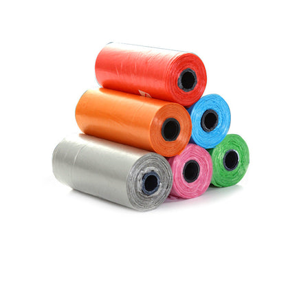 Stack of colorful rolls of plastic bags on a white background with text in red at the bottom.