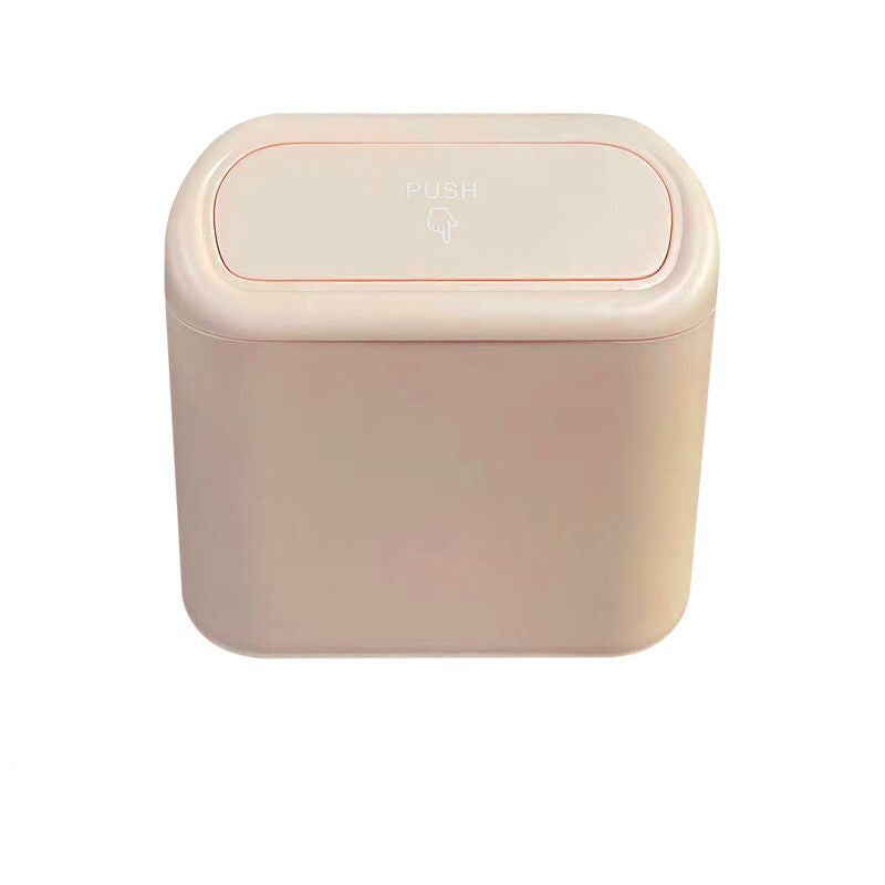 Beige trash bin with a lid on a white background