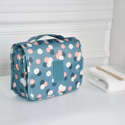 Floral-patterned toiletry bag on a white surface with a neutral background